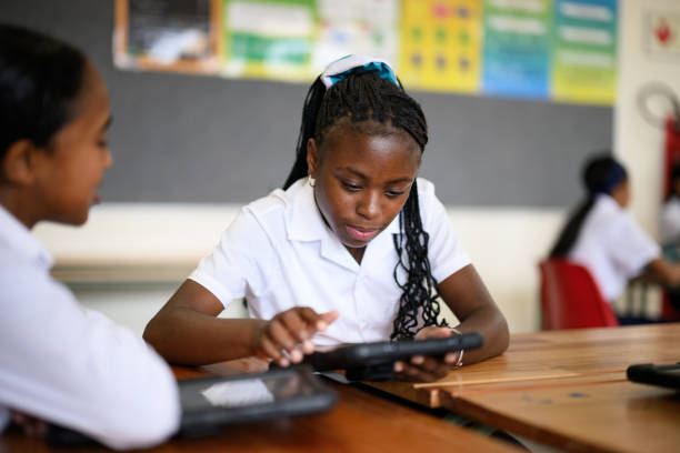 Learner using a tablet in class