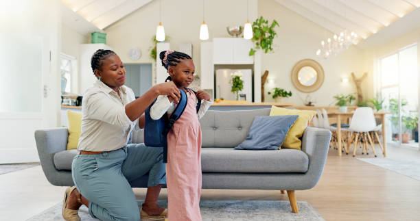 Parent helping her child get ready for school